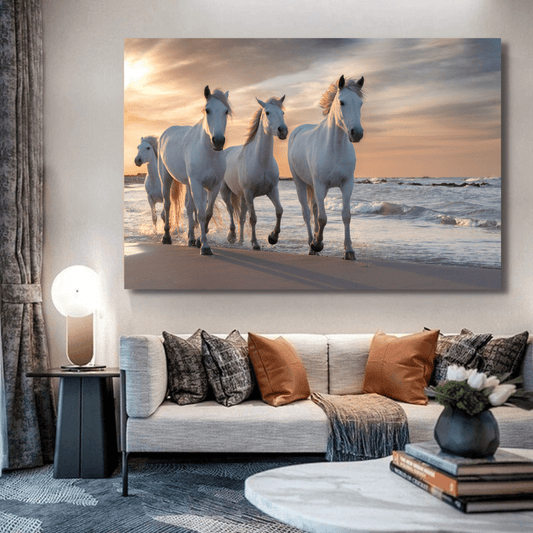 Horses on the beach at sunset